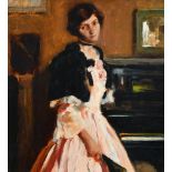 ‡Giannino Marchig (Italian 1897-1983) Portrait of a lady by a piano wearing a pink dress and holding