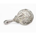 An Art Nouveau silver hand mirror, cast in low relief with an Art Nouveau maiden holding hand pipes,