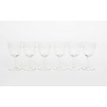 A set of six Art Nouveau wine glasses attributed to Theresienthal, the bowl engraved with a