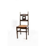 A rare oak side chair designed by Charles Francis Annesley Voysey, the oak frame, back with extended