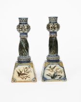 A pair of Martin Brothers stoneware candlesticks by Robert Wallace Martin, dated 1885, tapering