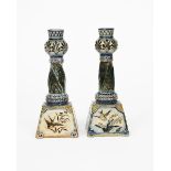 A pair of Martin Brothers stoneware candlesticks by Robert Wallace Martin, dated 1885, tapering