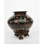 A Bombay School of Art Wonderland Pottery vase and stand, the ovoid vase with everted top rim,