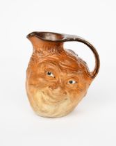 A Martin Brothers stoneware face jug designed by Robert Wallace Martin, dated 1899, modelled in