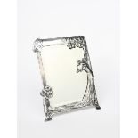 An Art Nouveau WMF desk mirror, shaped, rectangular form, cast in relief with an Art Nouveau