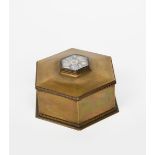 A hexagonal brass box and cover by E McEwen Osborne, dated 1931, on stepped foot, the cover inset