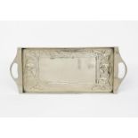 A Glasgow School white metal twin-handled tray, rectangular on ball feet, stamped in low relief with