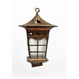 A large patinated copper hall lantern, tapering square section with lover light, overhanging
