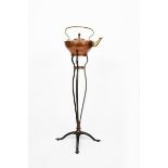 A WAS Benson copper and wrought iron kettle on stand, model no.790, wrought iron stand on
