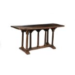 An oak and elm table, rectangular plank top, on H shaped stretcher, seven turned column legs and