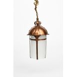 A patinated copper hall lantern, the domed hammered top with rivet panel decoration, four straps