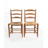 A pair of ash Clissett ladder back chairs designed by Neville Neal, with rush seat unsigned 88cm.