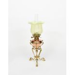 A copper and brass oil lamp in the manner of WAS Benson, tripod scrolling brass base supporting