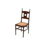 A rare oak side chair designed by Charles Francis Annesley Voysey, the oak frame, back with extended