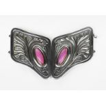 A Continental Jugendstil silver belt buckle, cast in low relief with Art Nouveau foliage, set with