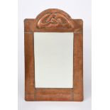 A Liberty & Co copper wall mirror designed by Archibald Knox, tapering rectangular form with stamped