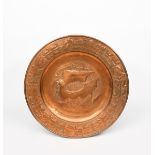 A Keswick School of Industrial Arts copper Galleon charger, the well stamped and hammered with a