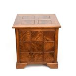 A Hugh Birkett walnut wine table, dated 1997, square section with panelled sides and hinged panelled