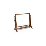 A Heal's oak dressing table mirror, the articulated rectangular mirror frame on flaring, carved
