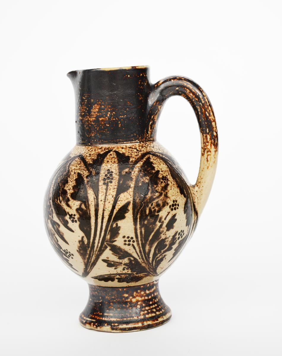 A Martin Brothers stoneware jug, dated 1884, ovoid body, painted with foliage sprays in chestnut