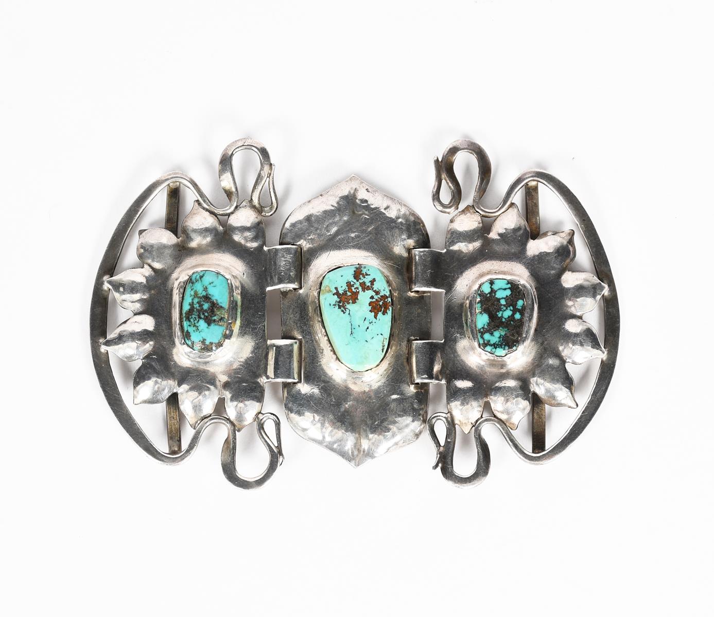A Liberty & Co Cymric silver belt buckle designed by Oliver Baker, cast scrolling foliate form