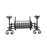 A wrought iron fire basket, with scroll feet and open basket terminals, unsigned, 85cm. wide,