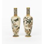 A pair of Martin Brothers stoneware bottle vases by Robert Wallace Martin, dated 1885, slender,