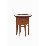 An oak and patinated copper side table in the manner of Liberty & Co, octagonal section on