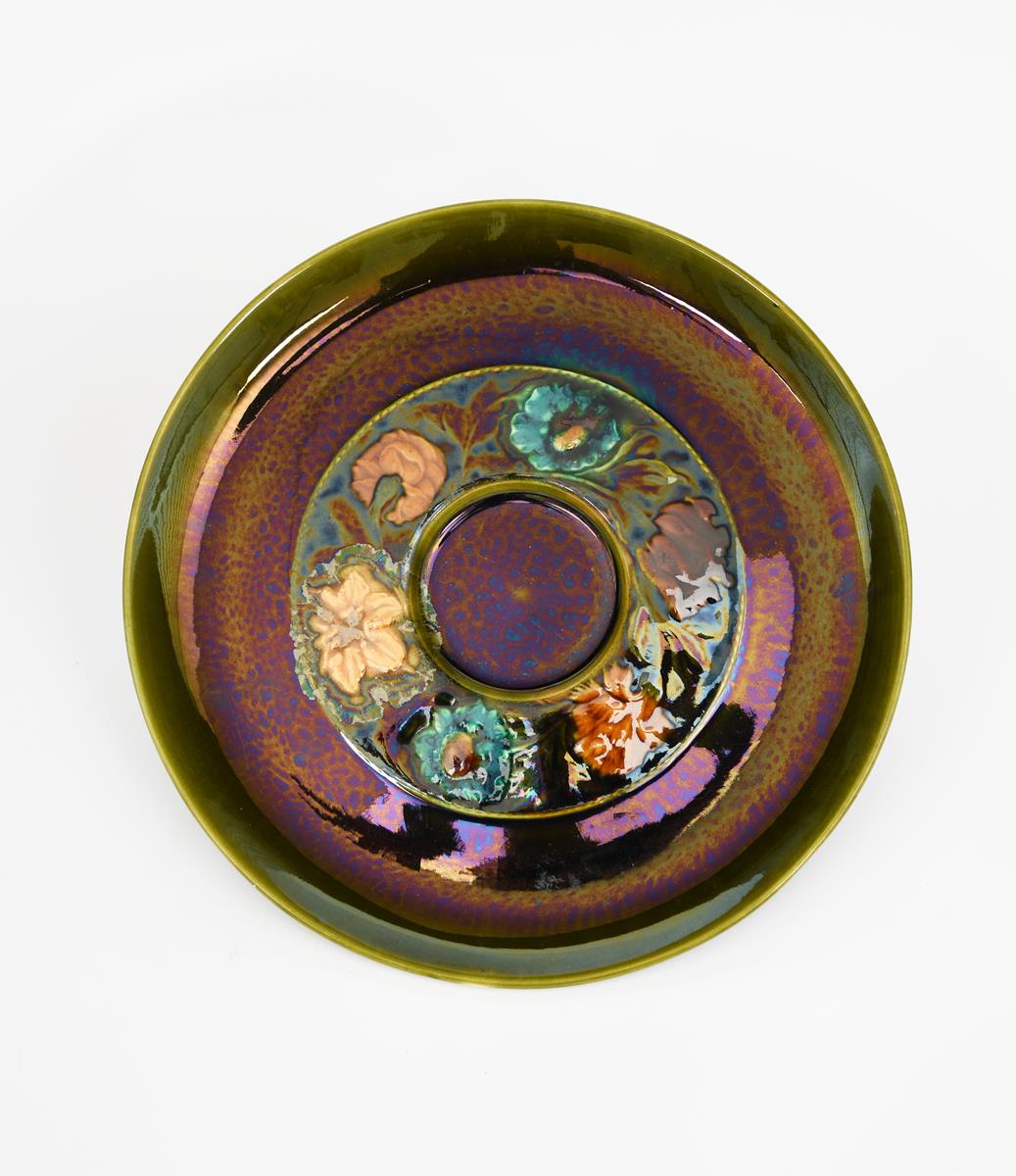 A Linthorpe Pottery plate designed by Dr Christopher Dresser, model no.299, circular, the well