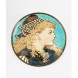A Mintons wall plate by Rebecca Coleman, dated 1876, painted with a portrait of a young girl wearing