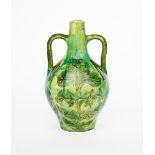 A Della Robbia pottery Moorish vase by Liz Wilkins, twin-handled form incised and painted with large