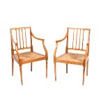 A pair of fruitwood armchairs, slender frame on turned legs, rush seat unsigned, 87cm. high (2)