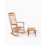 A natural ash rocking chair (no.10) by Neville Neal, with turned bobbin back and rush seat, and a