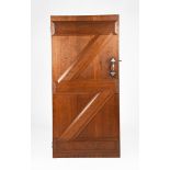 A large oak panelled door designed by Sir Edwin Lutyens, for the interior of Little Thakeham, ledged