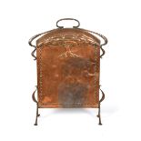 A copper and wrought iron firescreen in the manner of John Pearson, rounded rectangular panel