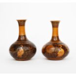 A near pair of Dunmore Pottery bottle vases by T W Haigh, dated 1879, in the manner of William
