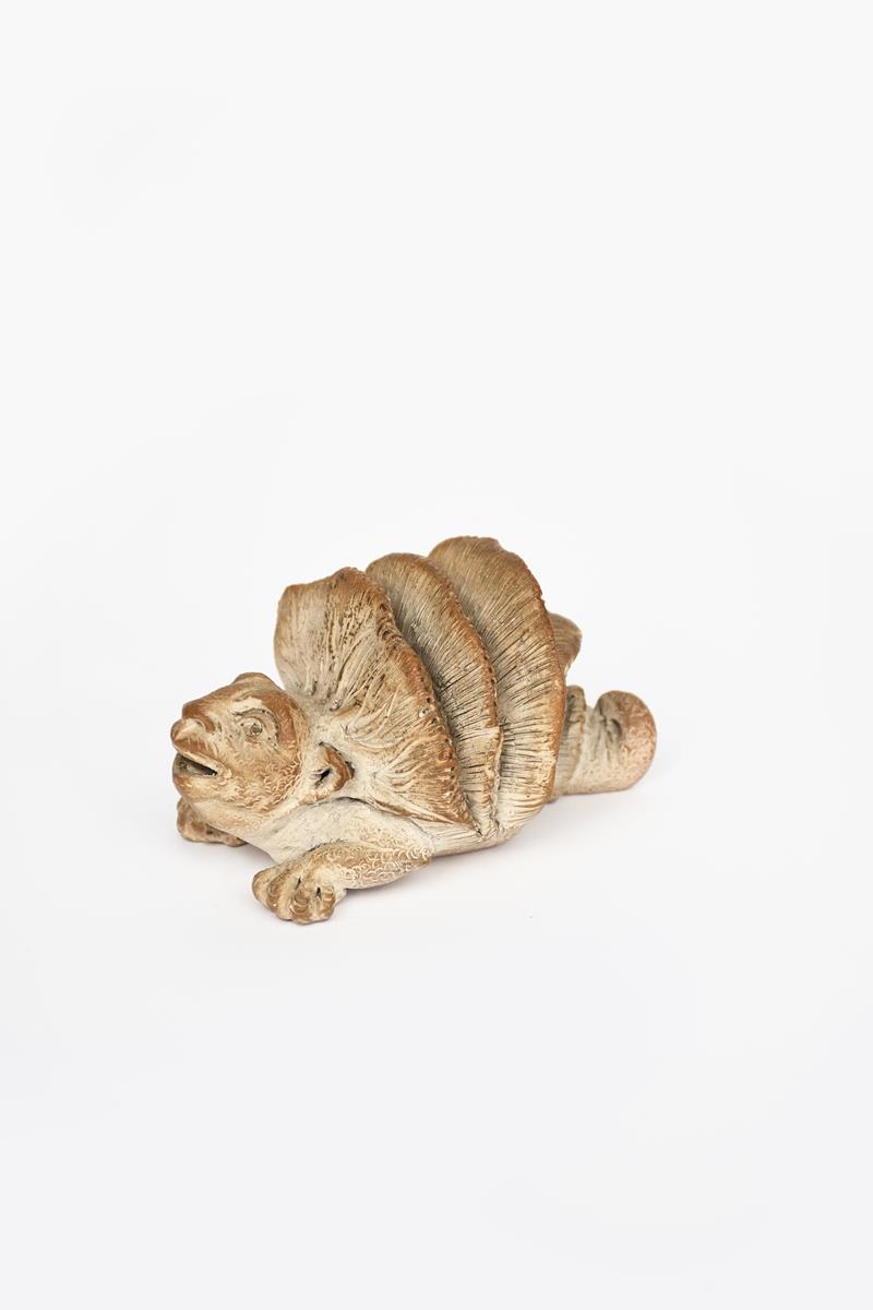 A Martin Brothers stoneware grotesque reptile creature by Edwin and Walter Martin, dated 1894,