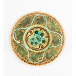 A Della Robbia Pottery charger by Violet Woodhouse, dated 1895, incised and painted with flower