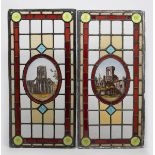 A pair of stained glass windows, rectangular, each set with central painted ruined landscape