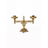 A Gothic Revival brass low candlestick designed by Bruce Talbert, probably made by Hart, Son Peard &