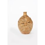 John Barleycorn a Martin Brothers Pottery stoneware bottle by Robert Wallace Martin, dated 1900,