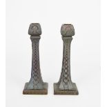 A pair of Burmantoft's Faience lustre candlesticks probably designed by Joseph Walmsley, shape no.