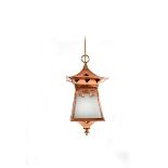 A copper and brass hall lantern, flaring square section with tapering base, the flaring overmantle