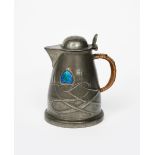 A Liberty & Co English Pewter jug designed by Archibald Knox, model no.0958, tapering cylindrical