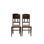 A pair of Liberty & Co oak chairs designed by William Neatby, tapering square seat with drop in