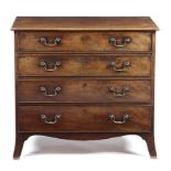 A LATE GEORGE III MAHOGANY DRESSING CHEST C.1800 the top drawer with a baize lined slide,