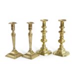 A PAIR OF BRASS CANDLESTICKS LATE 18TH CENTURY each with an ejector mechanism and square sockets,