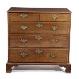 A GEORGE II RED WALNUT CHEST C.1750-1760 with two short and three long drawers, on bracket feet