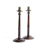 A PAIR OF TURNED MAHOGANY CANDLESTICKS IN GEORGE III STYLE LATE 19TH CENTURY each with a brass