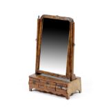 A GEORGE II WALNUT AND FEATHER BANDED DRESSING TABLE MIRROR EARLY 18TH CENTURY the shaped